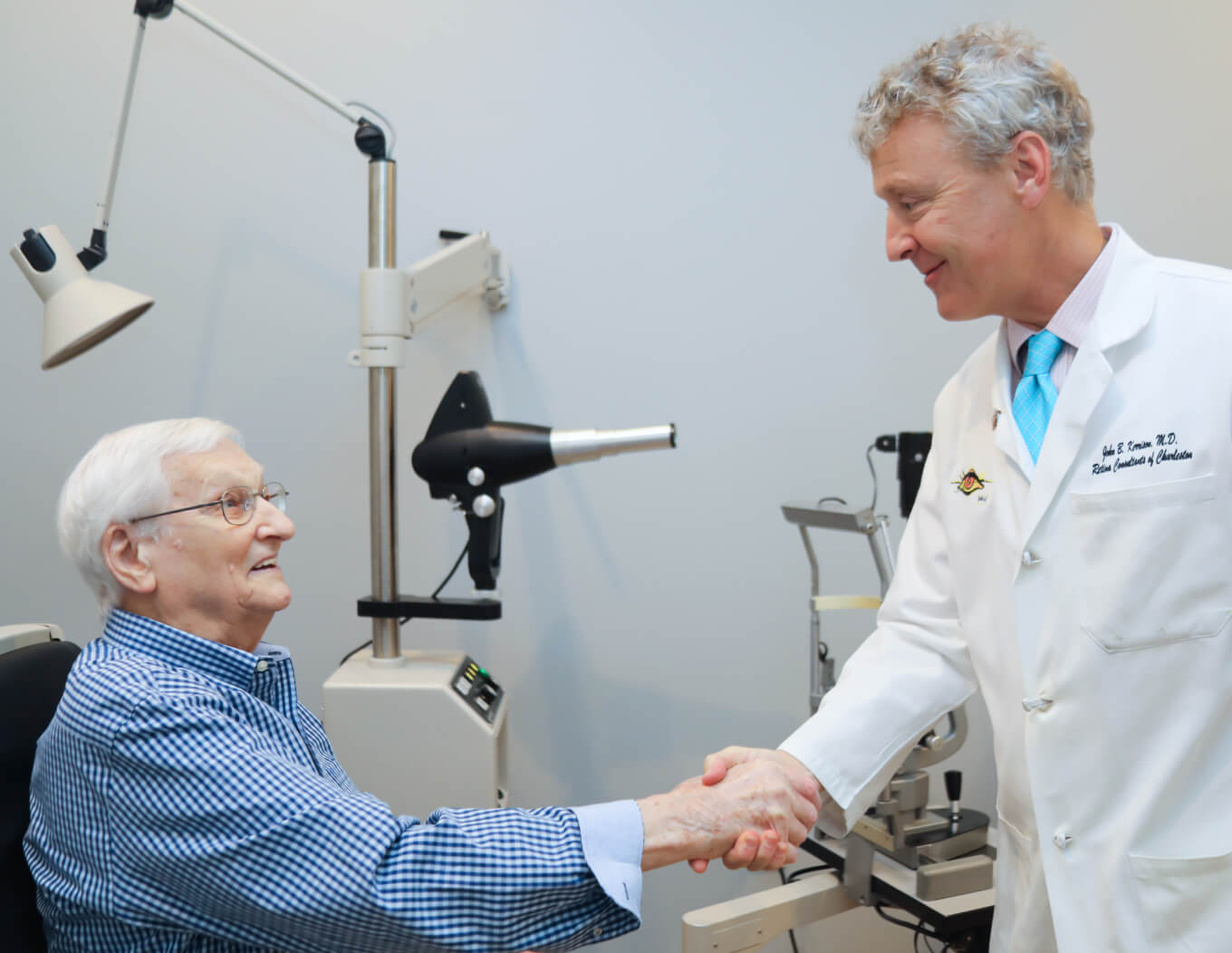 A provider shaking hands with his patient